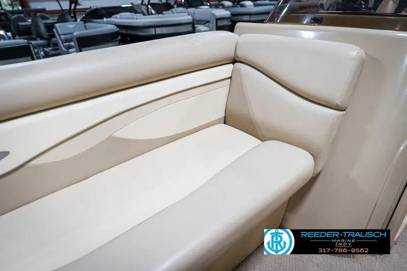 Slide: The Image of 2011 Bennington 17 Sli boat interior with beige seating, showcasing elegant design and comfort. - 36
