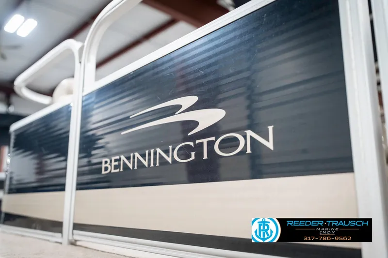 Slide: The Image of 2011 Bennington 17 Sli boat side view with logo in a showroom. - 42