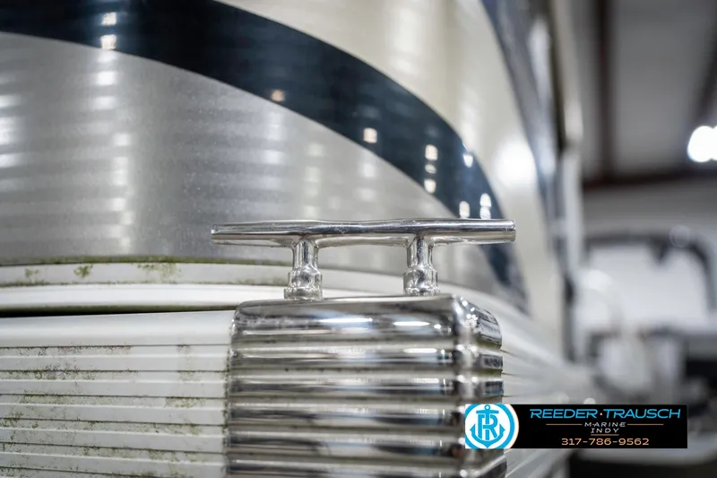 Slide: The Image of 2011 Bennington 17 Sli boat detail with chrome cleat and striped design. - 48