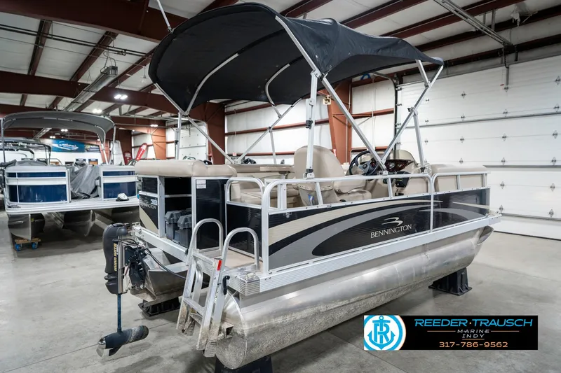 Slide: The Image of 2011 Bennington 17 Sli pontoon boat in indoor storage facility. - 8