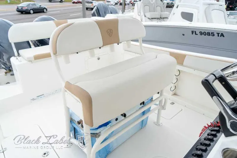 Slide: The Image of 2017 Century 2600 boat interior with beige seating and steering console. - 15