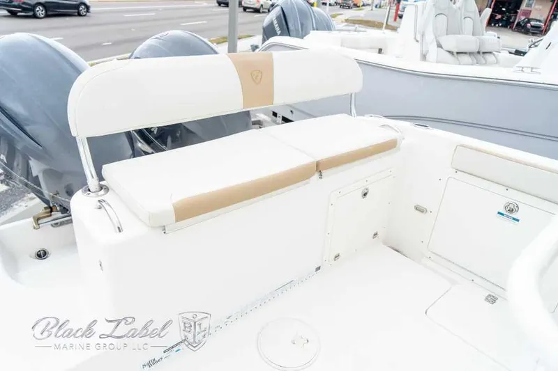 Slide: The Image of 2017 Century 2600 boat interior with cushioned seating and dual outboard motors. - 16