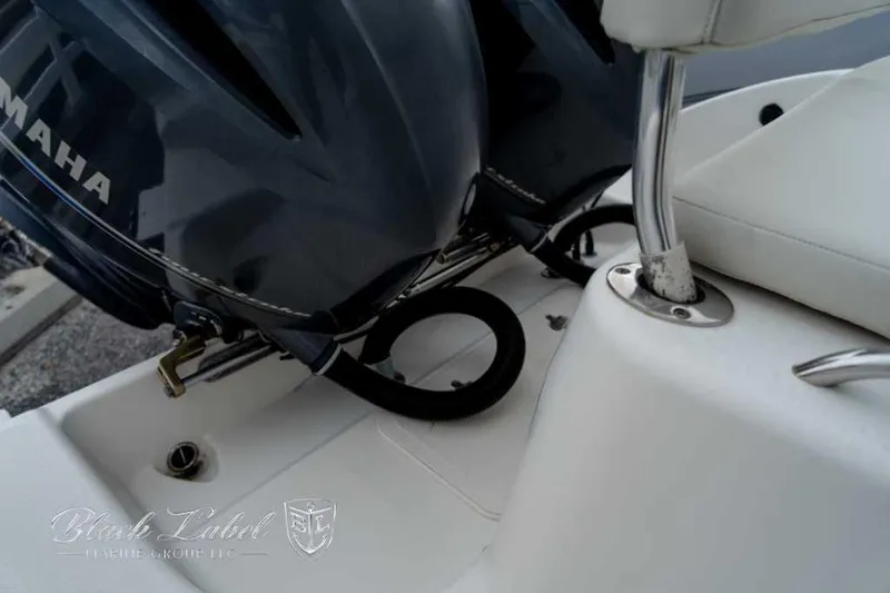 Slide: The Image of 2017 Century 2600 boat with Yamaha engine, featuring sleek white seating and chrome details. - 17