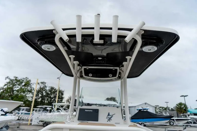 Slide: The Image of 2017 Century 2600 boat with T-top and rod holders, docked outdoors. - 18