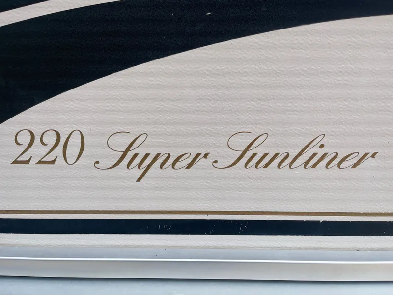 Slide: The Image of 2000 Harris-Kayot 220 Super Sunliner boat logo on a textured surface. - 5