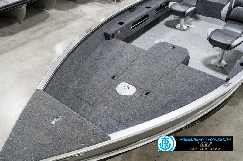 Slide: The Image of 2025 Lund 1775 Pro Guide boat interior with seating and carpeted deck. - 10