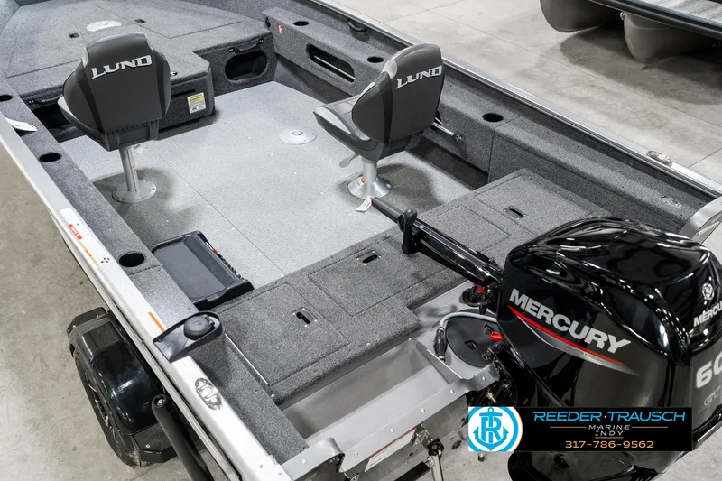 Slide: The Image of 2025 Lund 1775 Pro Guide boat interior with Mercury engine, featuring two seats and ample storage. - 13