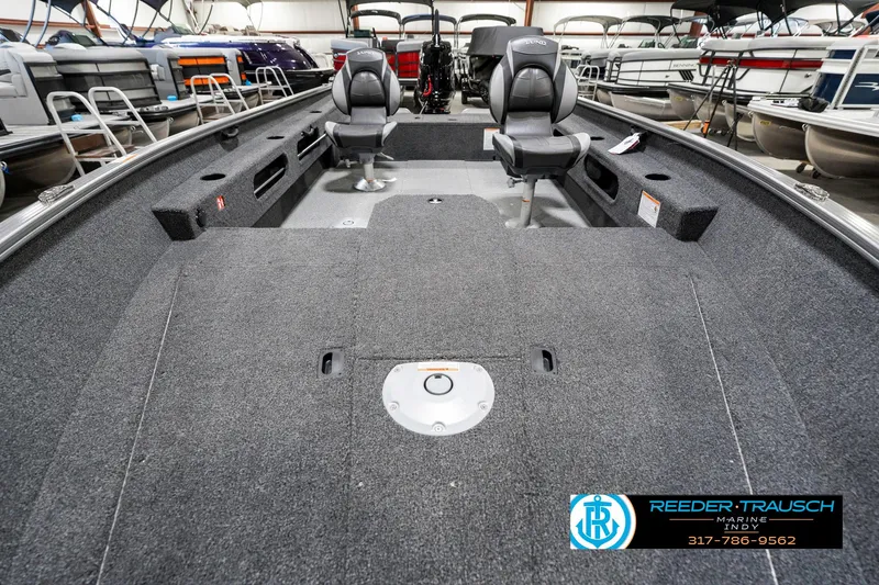 Slide: The Image of 2025 Lund 1775 Pro Guide boat interior with seating and storage compartments. - 17