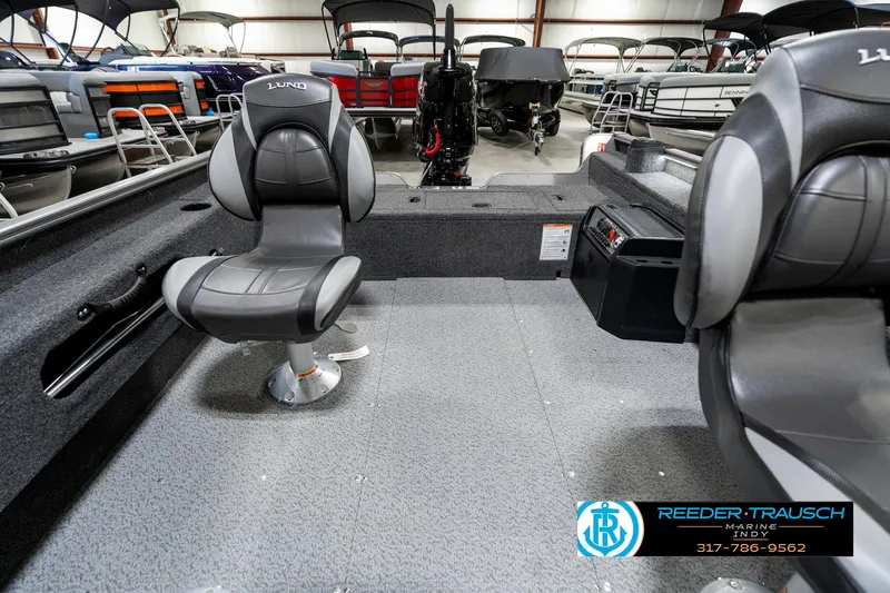 Slide: The Image of 2025 Lund 1775 Pro Guide boat interior with seating and storage compartments. - 18