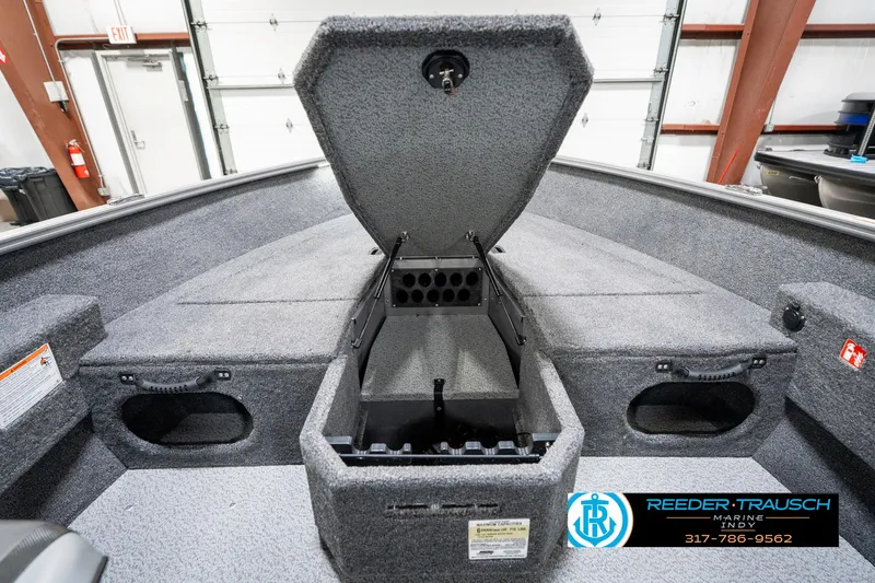 Slide: The Image of 2025 Lund 1775 Pro Guide boat interior with open storage compartment. - 24
