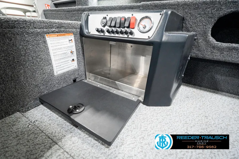 Slide: The Image of 2025 Lund 1775 Pro Guide boat console with storage compartment and control panel. - 26