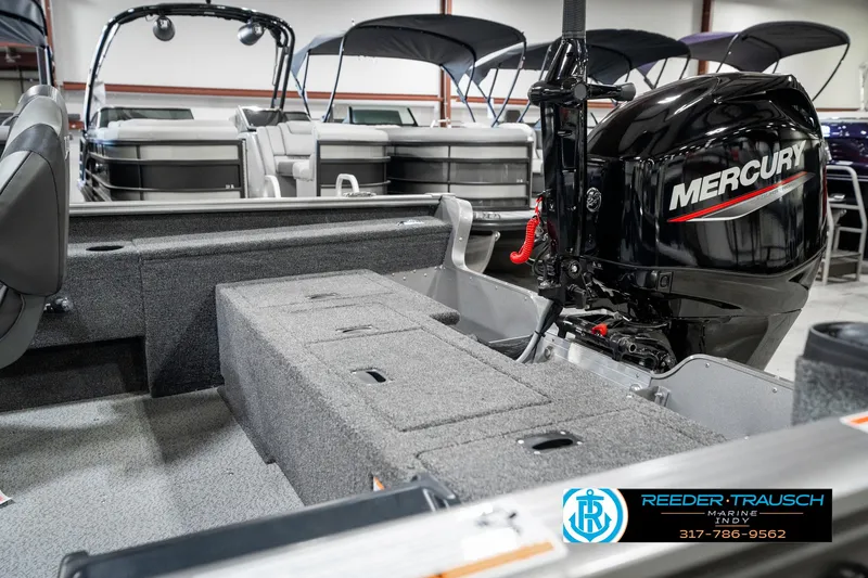 Slide: The Image of 2025 Lund 1775 Pro Guide boat interior with Mercury engine, showcased at Reeder-Trausch Marine. - 27