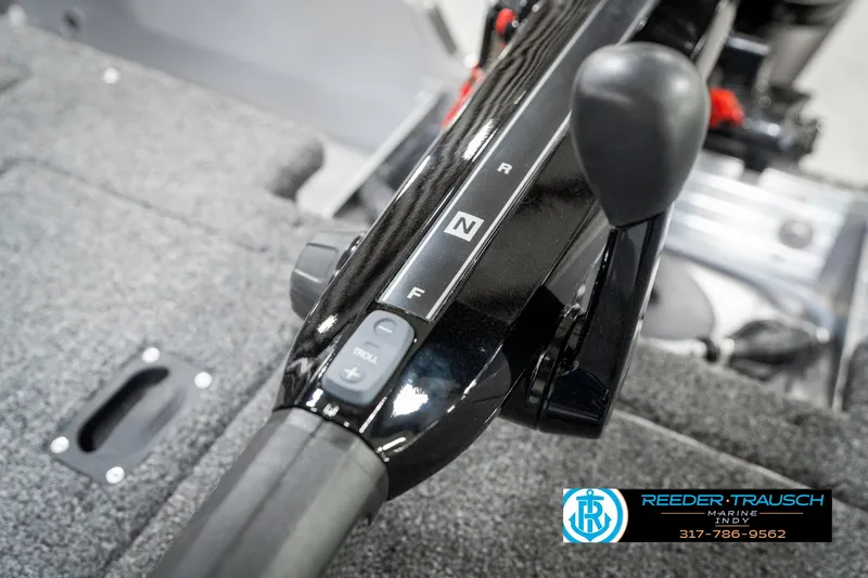 Slide: The Image of 2025 Lund 1775 Pro Guide boat throttle control with gear indicators. - 31