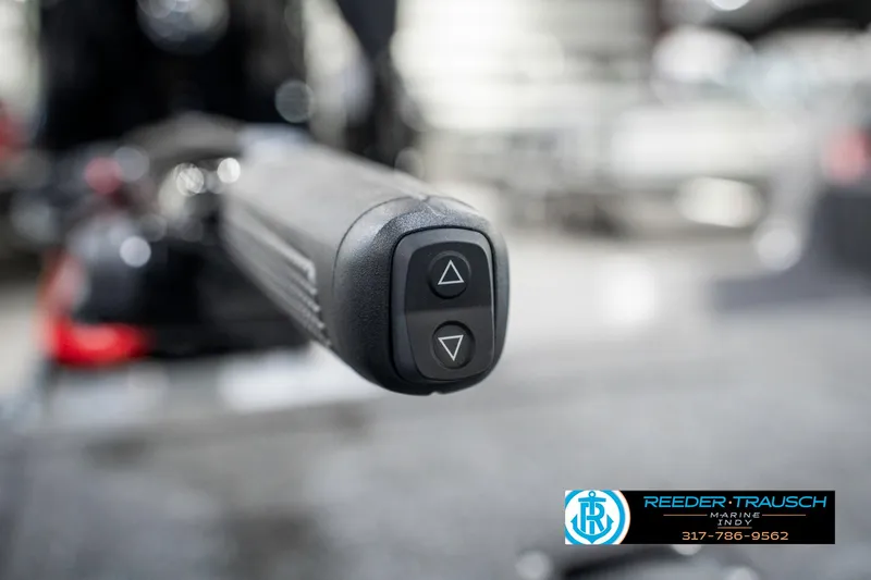 Slide: The Image of Close-up of a 2025 Lund 1775 Pro Guide boat control handle with buttons. - 32