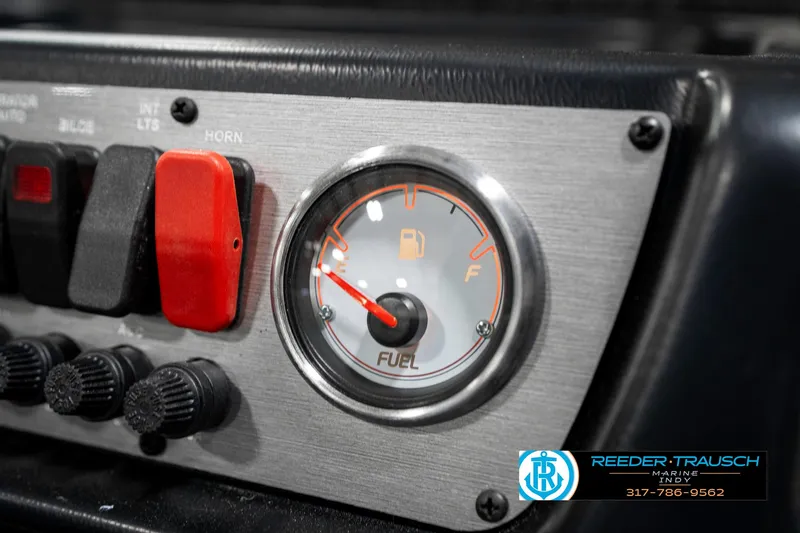 Slide: The Image of Fuel gauge and controls on 2025 Lund 1775 Pro Guide boat dashboard. - 39
