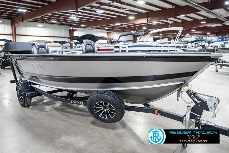 Slide: The Image of 2025 Lund 1775 Pro Guide boat on trailer in showroom, Reeder-Trausch Marine. - 4