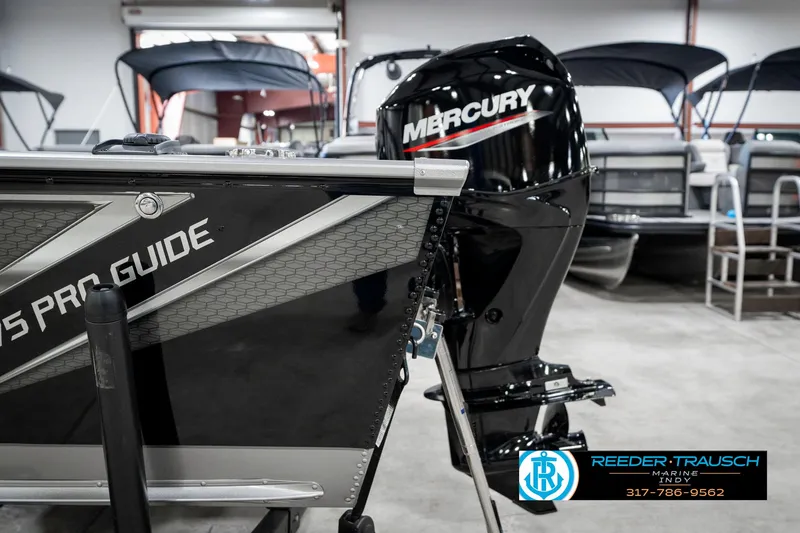 Slide: The Image of 2025 Lund 1775 Pro Guide boat with Mercury engine in showroom. - 41