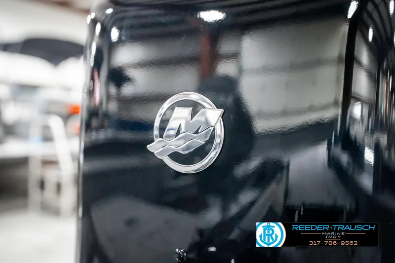 Slide: The Image of Close-up of a 2025 Lund 1775 Pro Guide boat engine with Mercury logo. - 42