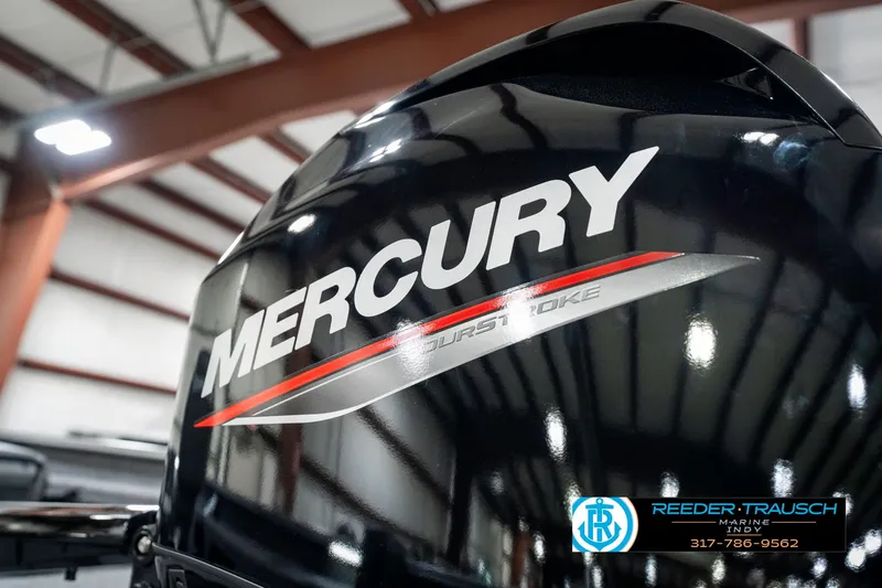 Slide: The Image of 2025 Lund 1775 Pro Guide with Mercury outboard motor in a showroom. - 43