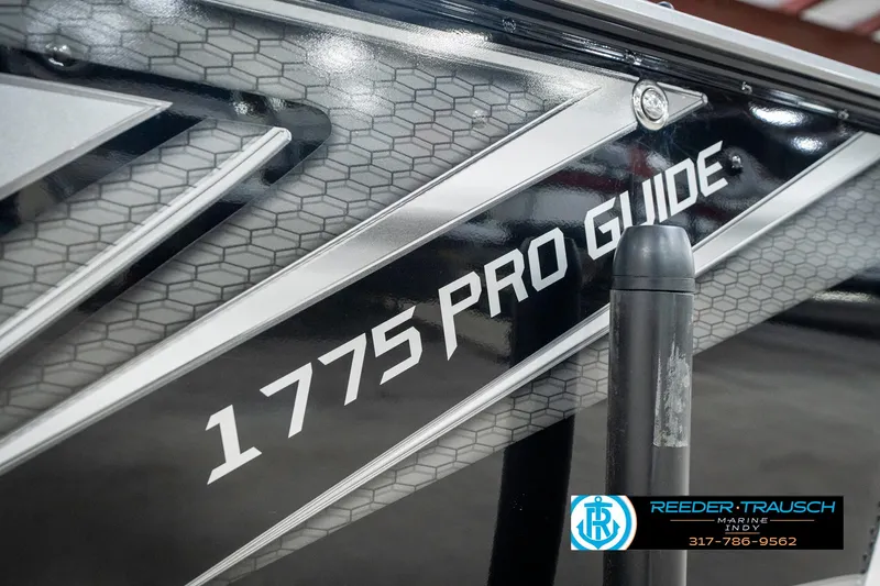 Slide: The Image of 2025 Lund 1775 Pro Guide boat with sleek design and branding. - 47