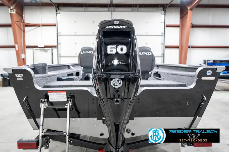 Slide: The Image of 2025 Lund 1775 Pro Guide boat with Mercury 60 engine in a garage. - 7
