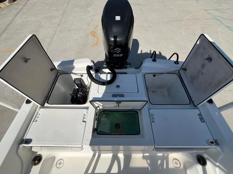 Slide: The Image of 2015 Epic 22 SC Center Console Bay Boat with open storage compartments and 250 HP engine. - 12