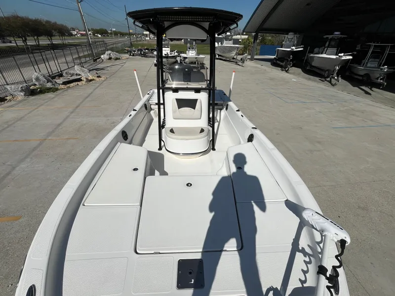 Slide: The Image of 2015 Epic 22 SC Center Console Bay Boat on display in a marina setting. - 15