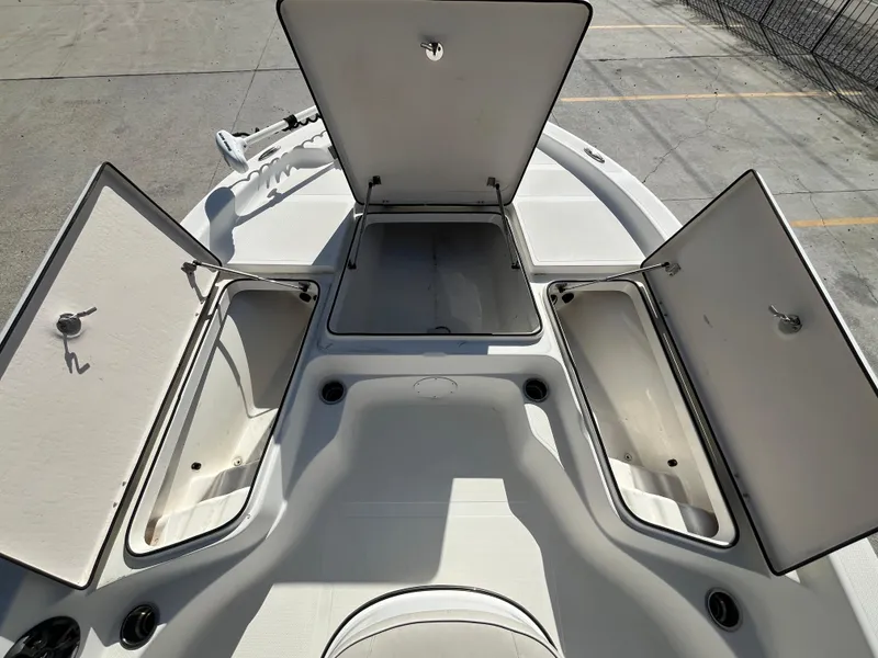 Slide: The Image of 2015 Epic 22 SC Center Console Bay Boat with open storage compartments. - 17