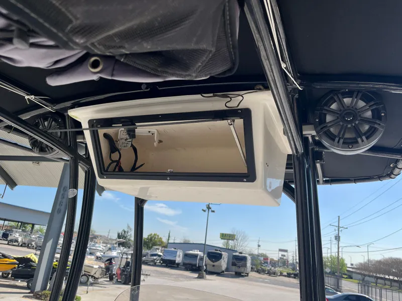 Slide: The Image of 2015 Epic 22 SC Center Console Bay Boat interior with speaker and storage compartment. - 20