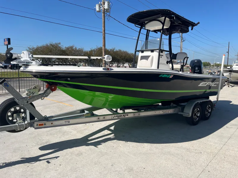 Slide: The Image of 2015 Epic 22 SC Center Console Bay Boat on trailer, featuring a sleek black and green design. - 4