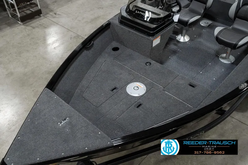 Slide: The Image of 2025 Lund 1650 Rebel XL SS boat interior with seating and storage compartments. - 10