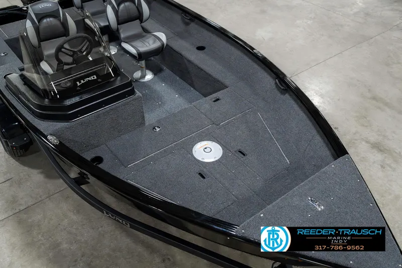 Slide: The Image of 2025 Lund 1650 Rebel XL SS boat interior with seating and steering console. - 11