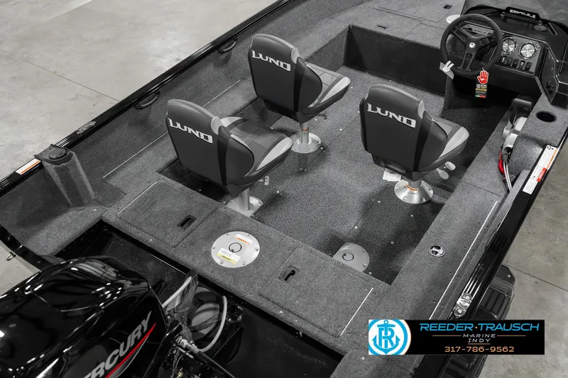Slide: The Image of 2025 Lund 1650 Rebel XL SS boat interior with three seats and a Mercury engine. - 12