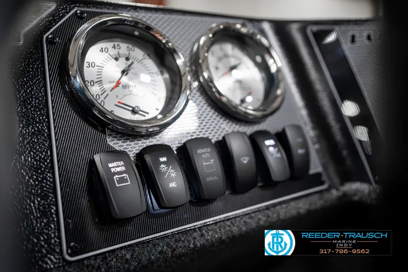 Slide: The Image of Dashboard of 2025 Lund 1650 Rebel XL SS boat with gauges and switches. - 34