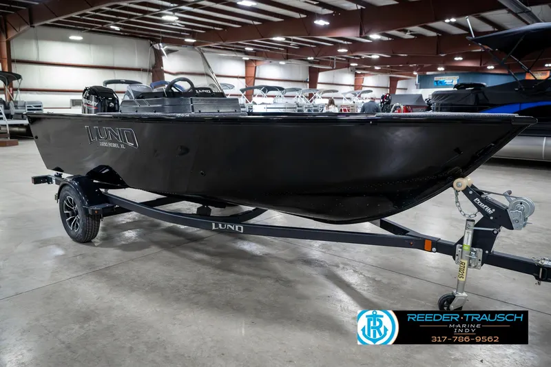 Slide: The Image of 2025 Lund 1650 Rebel XL SS boat on trailer in showroom. - 4