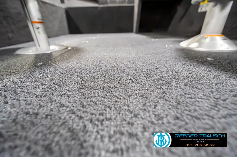 Slide: The Image of 2025 Lund 1650 Rebel XL SS boat interior with carpeted flooring and pedestal mounts. - 43