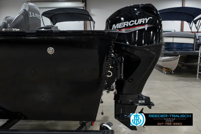 Slide: The Image of 2025 Lund 1650 Rebel XL SS boat with Mercury outboard motor in showroom. - 44