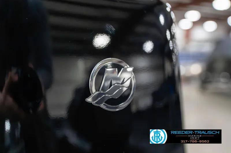 Slide: The Image of 2025 Lund 1650 Rebel XL SS boat with Mercury logo, indoor showroom setting. - 47