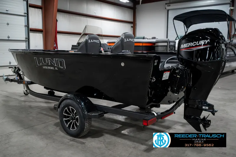 Slide: The Image of 2025 Lund 1650 Rebel XL SS boat with Mercury engine in showroom. - 8