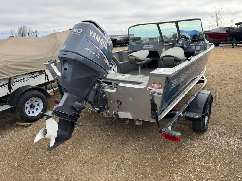 Slide: The Image of 2012 Alumacraft 165 Competitor boat with Yamaha outboard motor on trailer. - 2