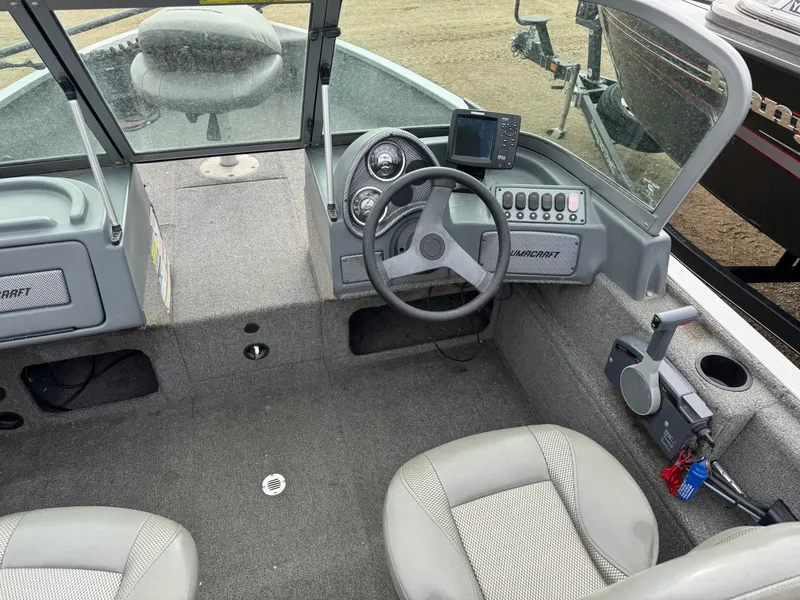 Slide: The Image of 2012 Alumacraft 165 Competitor boat interior with steering wheel and control panel. - 9