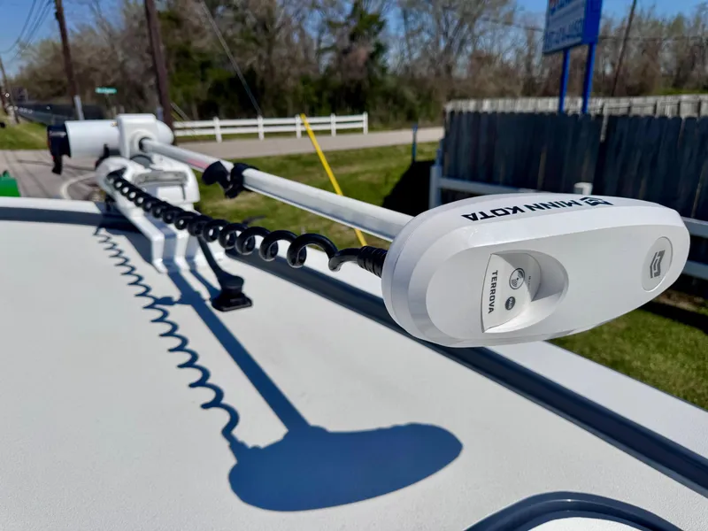 Slide: The Image of 2024 Shallow Sport 25 X3 boat with Minn Kota trolling motor on deck. - 16