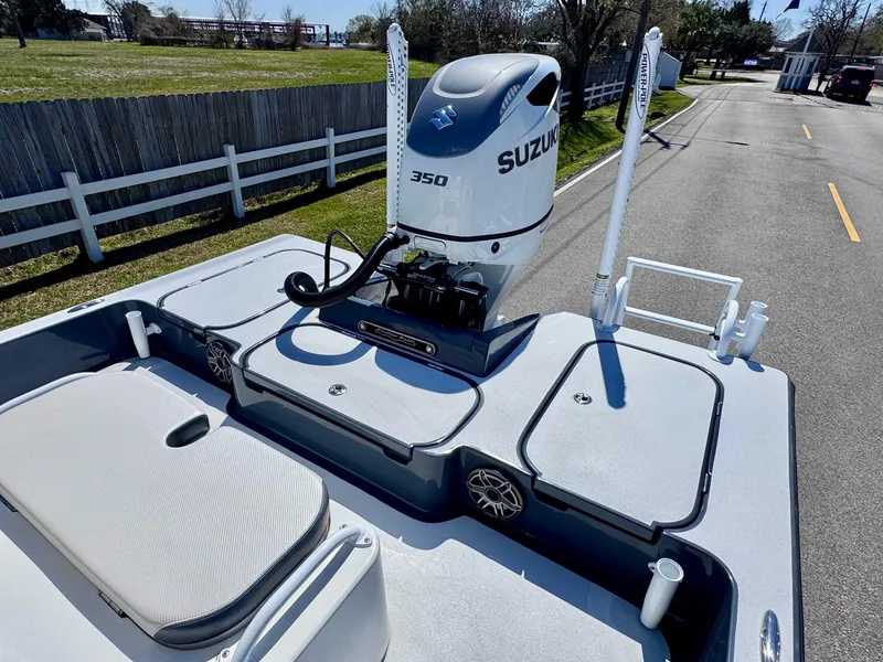 Slide: The Image of 2024 Shallow Sport 25 X3 boat with Suzuki 350 engine on a sunny day. - 7