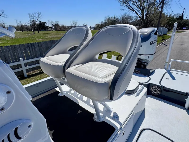 Slide: The Image of 2024 Shallow Sport 25 X3 boat with dual seats and Suzuki engine. - 9