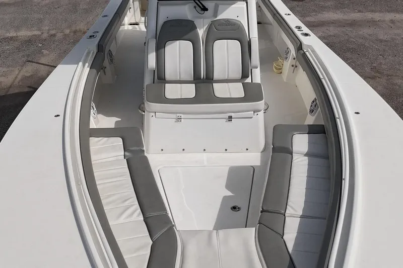 Slide: The Image of 2023 Regulator 28 boat interior with gray and white seating arrangement. - 27