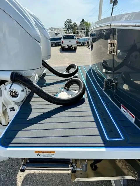 Slide: The Image of 2023 Regulator 28 boat with dual engines and sleek deck design. - 9