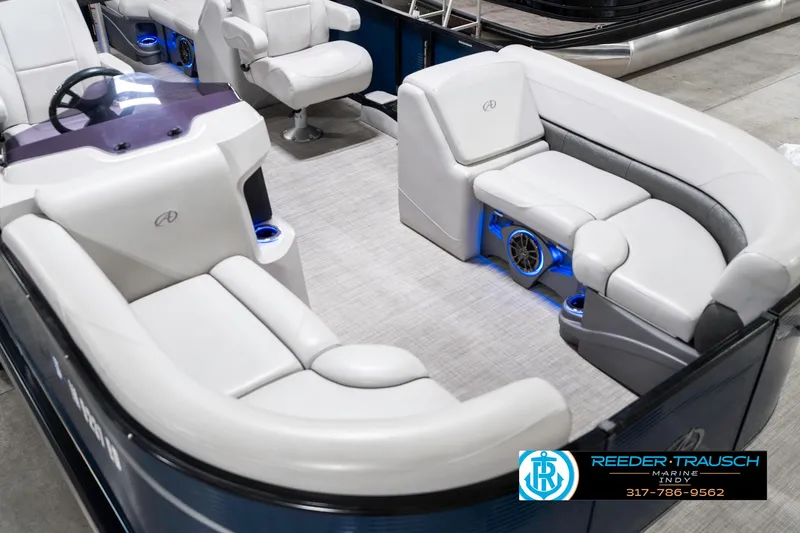 Slide: The Image of 2020 Avalon 2485 boat interior with white seating and blue LED lighting. - 13