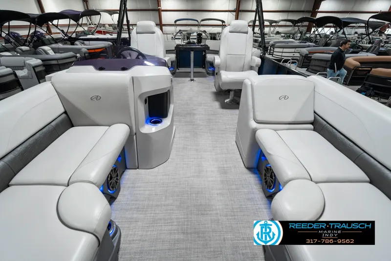 Slide: The Image of 2020 Avalon 2485 boat interior with luxurious seating and blue LED lighting. - 19