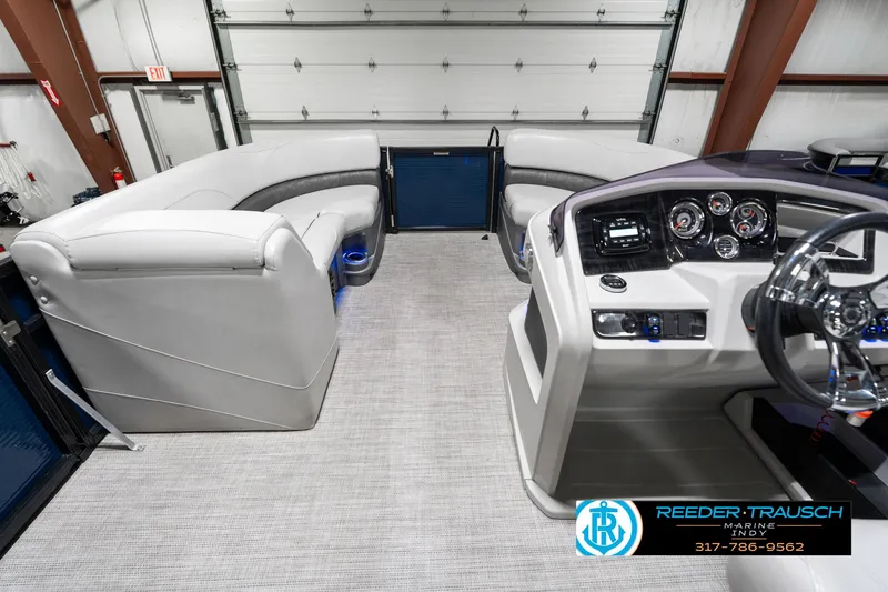 Slide: The Image of Interior of a 2020 Avalon 2485 boat with modern seating and control panel. - 22