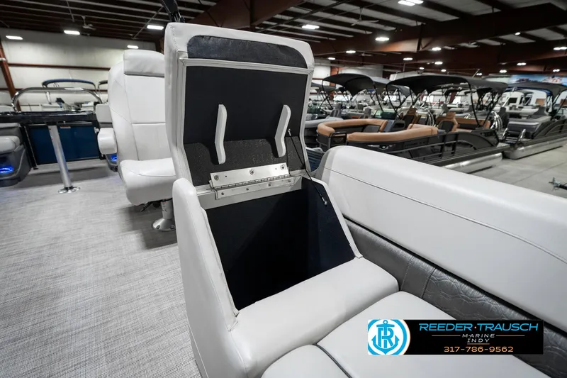 Slide: The Image of Interior of a 2020 Avalon 2485 boat showing open storage compartment. - 26